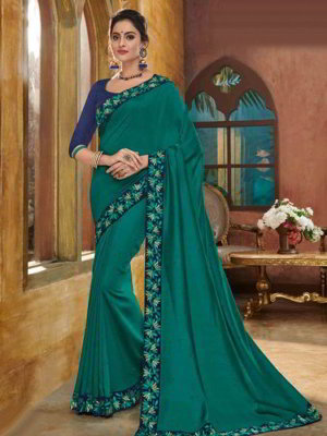 Зелёное шёлковое индийское сари, украшенное вышивкой