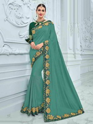 Зелёное шёлковое индийское сари, украшенное вышивкой с пайетками