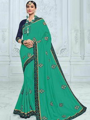 Зелёное шёлковое индийское сари, украшенное вышивкой